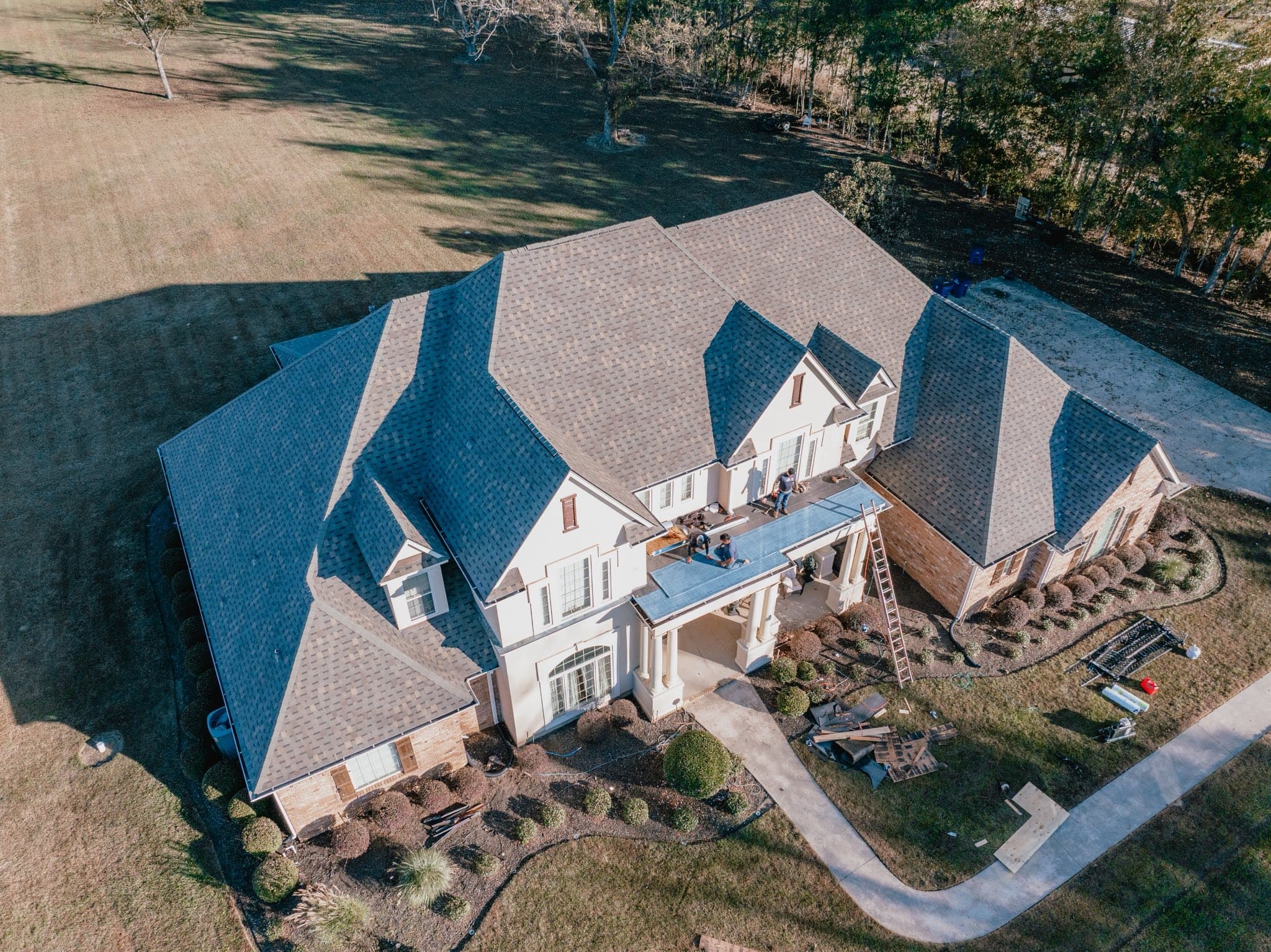 Aerial view of a completed residential roof by Jake Lilly Roofing