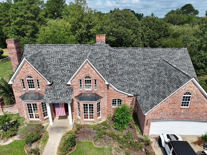 Aerial view of finished roofing project on residential home